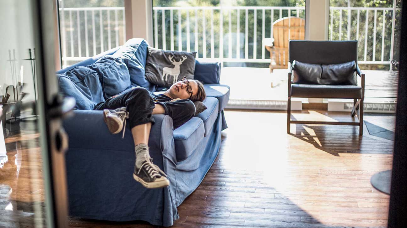 lady fast asleep on her couch