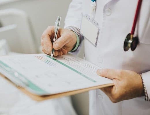 doctor writing down notes